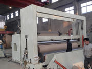What are the causes of paper staining on the slitter rewinder?